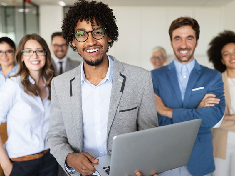 Portrait-of-business-team-posing-in-office