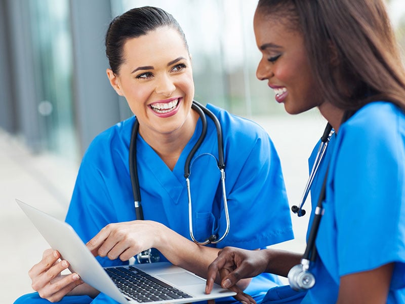 young-female-nurses-having-fun-with-laptop