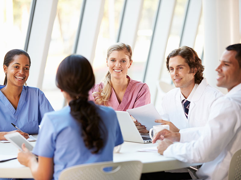 Medical-Team-Meeting-Around-Table-In-Modern-Hospital